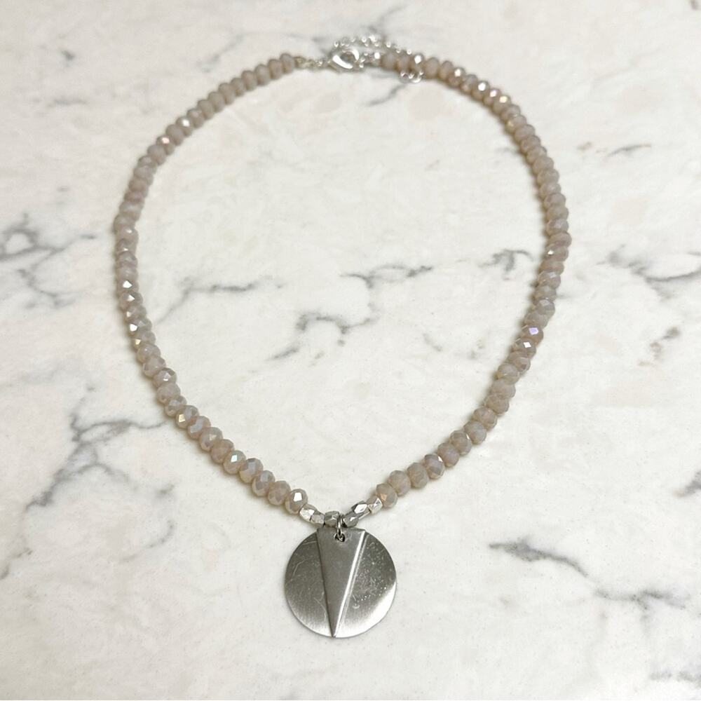 Elegant Beige Beaded Necklace with Silver Pendant